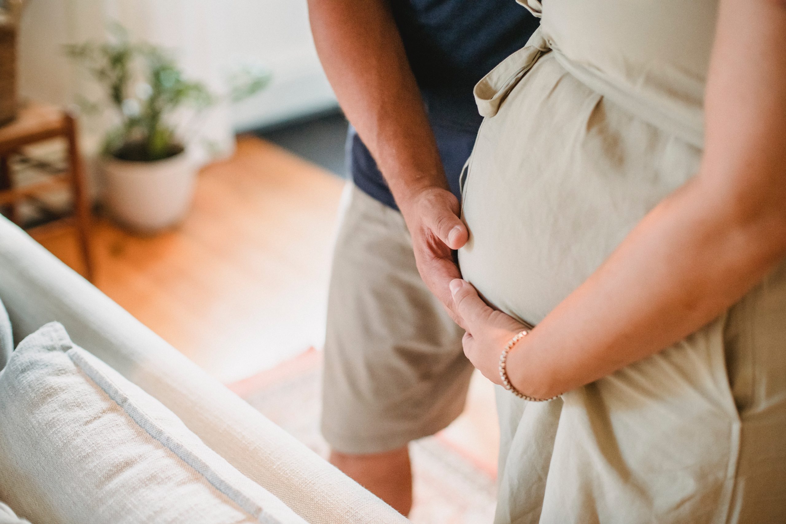 pregnant woman speaking with husband